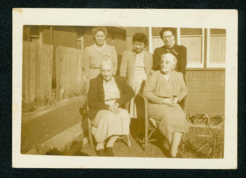 413 Barbara-Stephenson-and-Amy-Connolly-seated-with-members-of-the-Liu-family